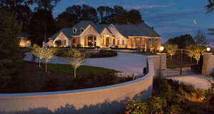 Indianapolis home with landscape lighting at night